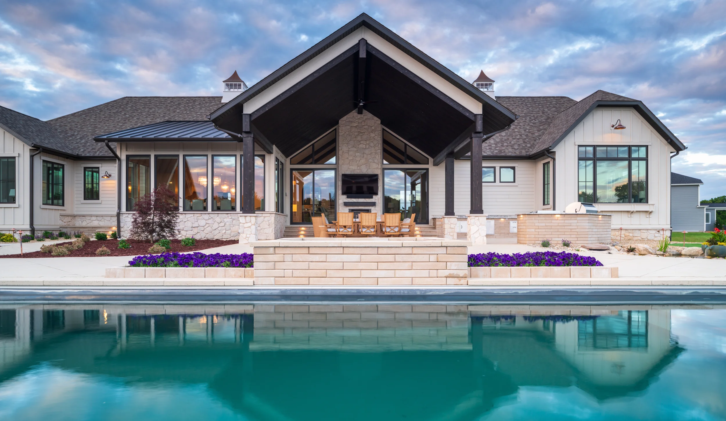 Pool in front of a covered patio