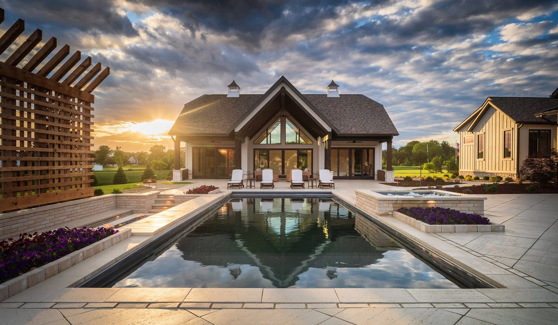 Fiberglass pool and patio built by RC Outdoor at sunset