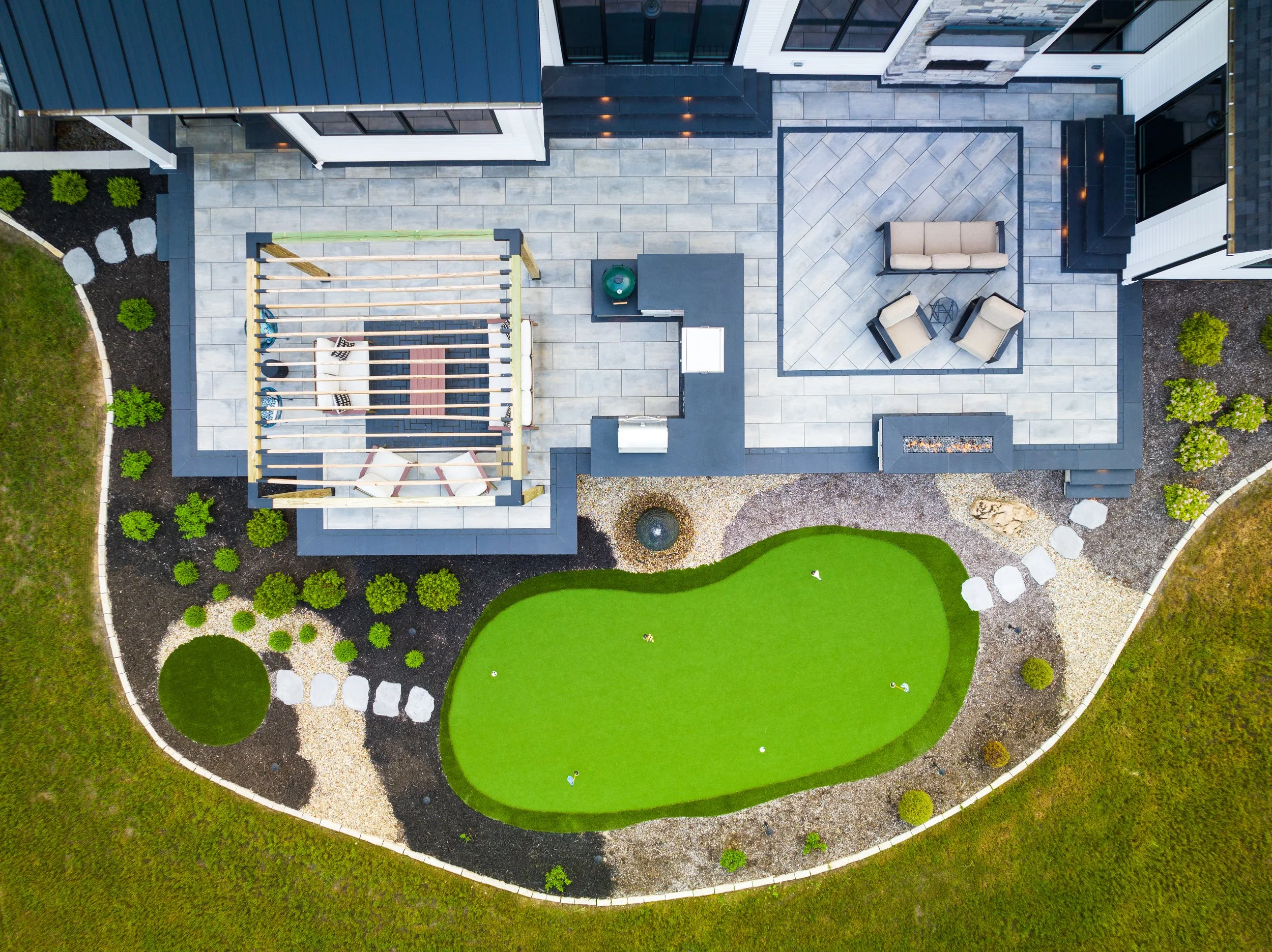Aerial view of a backyard patio and pergola built by RC Outdoor